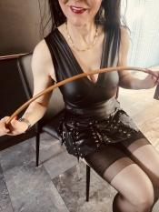 Miss awaits you for a caning! 
